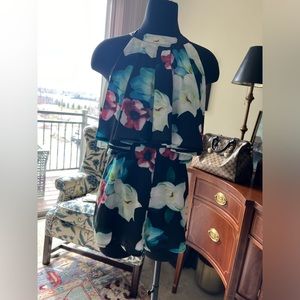 Blush Romper size Medium runs small navy with flowers like new